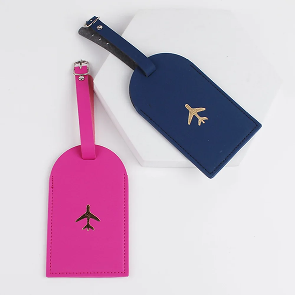 Etiquetas de bagagem rosa-choque e azul-marinho